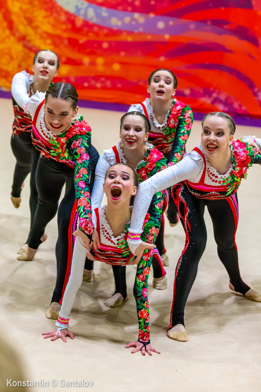 Gymnastics team in floral competition costumes